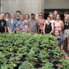 VIU Horticulture students in front of plants inside greenhouse