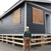 Carpentry student Emily Behm standing in front of the tiny home she and her classmates are building at the Cowichan Trades Centre