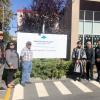 Group photo around the new sign at VIU’s campus in the qathet region 