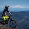 A mountain biker takes in the views on a sunny day